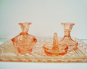 Pink glass vanity set for vintage dressing table