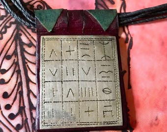 Tuareg Gri Gri AMULET with Tifinagh signs, the alphabet of the Tuareg people on dark Red Leather, incl. Tuareg Leather Necklace