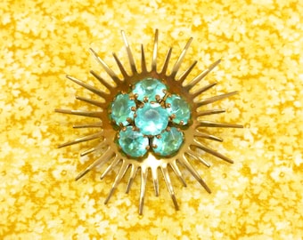 Vintage turquoise rhinestone sun/starburst brooch