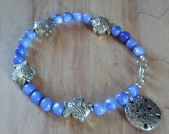 Blue shell with silver fish and sand dollar charm bracelet, vegetable dyed blue shell bracelet, fish bracelet, sand dollar charm bracelet
