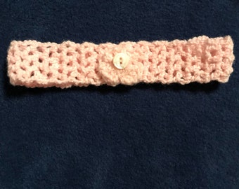 Handmade crocheted headband with flower and button