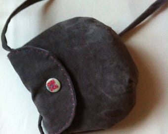girl with a Suede flap bag grey suede
