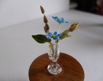 One 12th scale Miniature Flowers in a vase .
