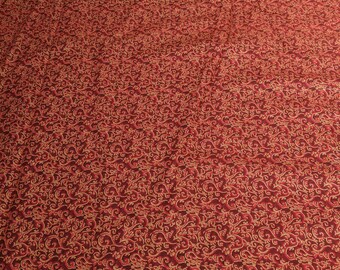 Season's Greetings-Red and Gold Swirls Cotton Fabric from Fabri-Quilt