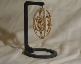 Hand carvings in various kinds of wood, done on a scroll saw.