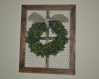 Boxwood wreath wall decoration