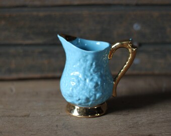 Blue and gold pitcher