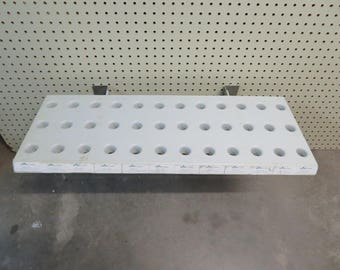 floral stem display shelf,salvaged store fixture,adjustable,fits into pegboard,shop,floral designer workshop,storage,working shelf,organizer