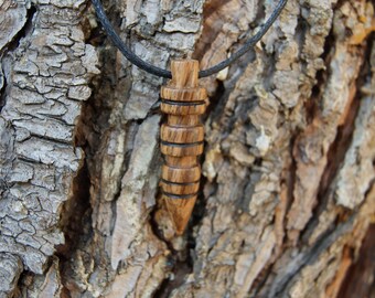 Pendant has been hand turned in exotic wood