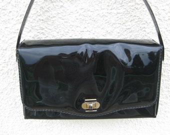 French black lacquer plastic handbag without shoulder strap.