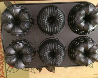 Six Cake Bundt Pan Cathedral, Fleur de Lis, Bavaria Shapes Non-Stick Baking Ware