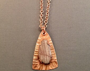 Polished stone on copper
