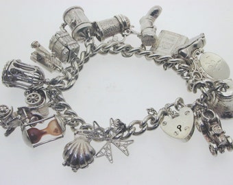 Silver charm bracelet 16 charms, most opening 7" heavy 81.5 grams heart padlock