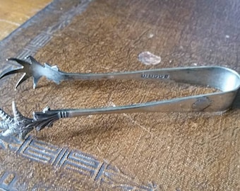 Antique silver plated sugar tongs.