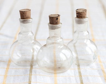 Clear glass bottles_corked glass containers_set of three_transparent glass_Edwardian lab collectibles_lab glass_steampunk industrial decor
