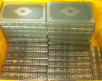 Set of 34 Charles Dickens Vinyl covered books by Heron Books.