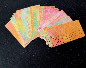 Multicolored tags with gold sparkle