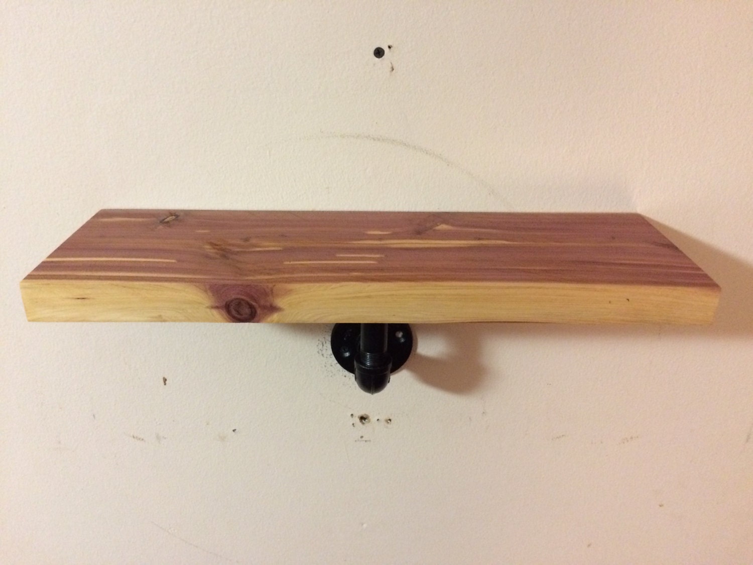 Floating cedar shelf with pipe brackets rustic floating