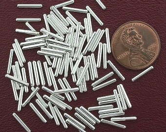 one hundred 9.5mm silver plated tube beads