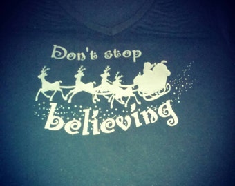 Don't stop believing Santa clause shirt.