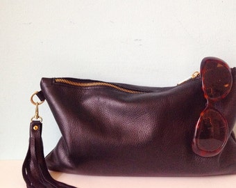 Oversized black leather clutch bag, zipped purse, make up bag