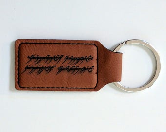 One Keyring to Rule Them All: The One Ring inscription laser engraved leatherette keychain. customise with your name in English or Elvish!
