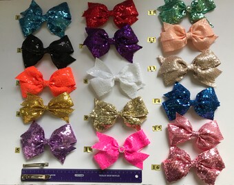Hair bow clips for girl made by sequin fabric in many models each 8.00