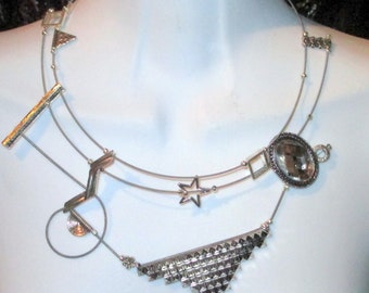 Cosmos, asymmetrical silver necklace,guitar strings, stars, sparkling,layered, geometric, contemporary,textured, sculptural,handmade