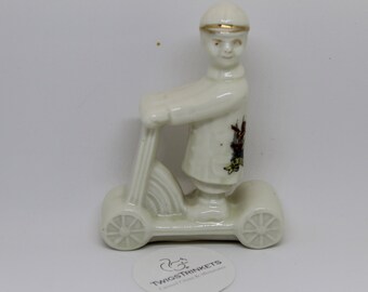 Unusual Crested China Boy on a Scooter