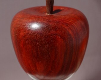 Apple bottle stopper, made of redheart and walnut.