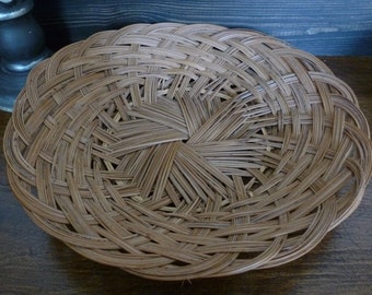 Woven dish, plate, basket, tray.