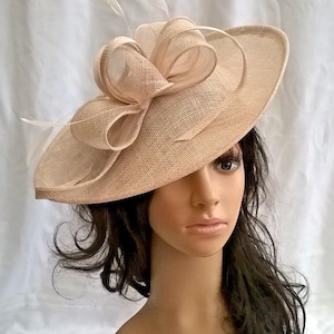 Stunning Champagne Sinamay Shaped disc Fascinator with swirls,loops & coque feathers..wedding,races