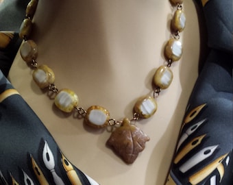 One strand beaded necklace with center drop