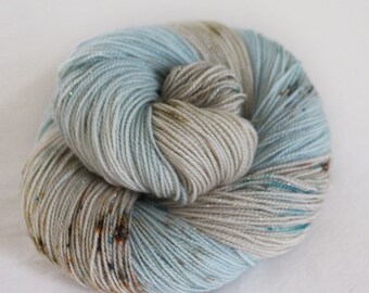 By The Sea - Magpie - 75/20/5 superwash merino/ nylon/ gold stellina sock yarn