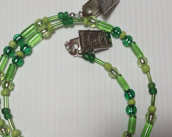 Beaded napkin serviette clip holder In green tones