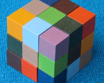 Nonahuebes or Nine Colour Puzzle, 2cm coloured wooden cubes.