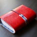 Elegant journal in red leather, Midori structure, replaceable internal sections and marbled paper inside.