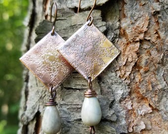 Handmade etched copper earrings.