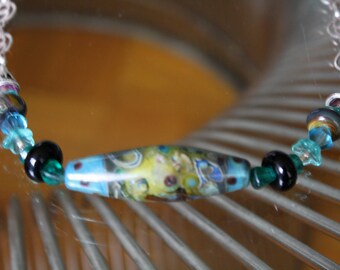 Beaded Necklace with blues and purples and Lampwork center