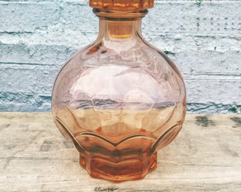 Beautiful vintage pink glass dressing table bottle.