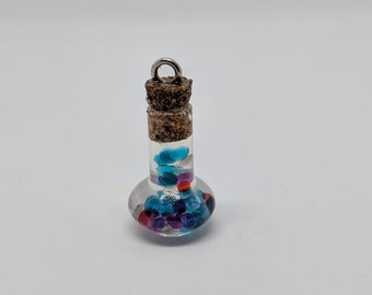 Miniature bottle with tiny rhinestones