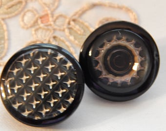 Design Under Plastic - 2 Vintage Buttons