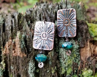Handmade etched copper earrings.