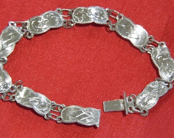 A Vintage Sterling silver etched panel bracelet