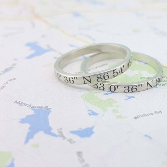 sterling silver rings on map