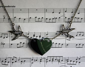 Petit British racing green colour label record necklace with bronze swallowtails. Cut from a pre-loved record