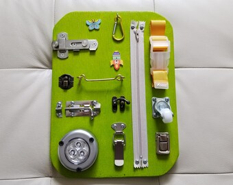 Travel Busy Board. Activity board, early development Montessori educational toy.