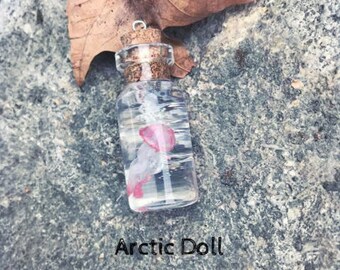 Vial glass with iridescent jellyfish necklaces