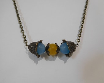 Blue and yellow agate with bronze flower beadcaps on 18 inch chain