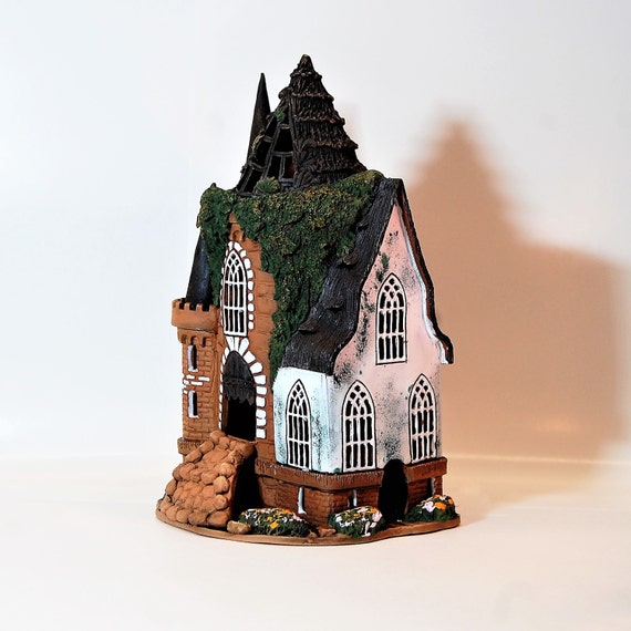 Candle. Ceramic candle holder houses old castle White